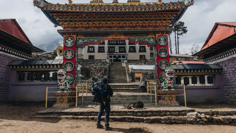 Traveler in Front of Buddhist Monastery in Tengboche, Nepal